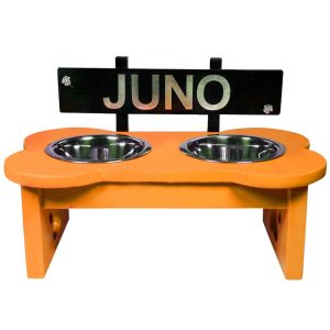 two dog bowls with orange table with Juno name plate